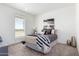 Bedroom with queen bed, nightstand and artwork at 900 N Windy Meadow Ln, Maricopa, AZ 85139