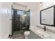 Modern bathroom with gray tile shower and granite vanity at 3368 W Judd Rd, San Tan Valley, AZ 85144