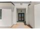 Modern double front doors with a metal frame and glass panels at 3368 W Judd Rd, San Tan Valley, AZ 85144