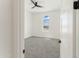 Charming bedroom with arched window, ceiling fan and grey carpet at 3368 W Judd Rd, San Tan Valley, AZ 85144