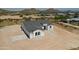 Modern home with a grey tile roof and mountain views at 3368 W Judd Rd, San Tan Valley, AZ 85144