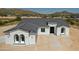 Modern home with a grey tile roof and mountain views at 3368 W Judd Rd, San Tan Valley, AZ 85144
