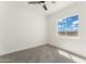 Bright bedroom with gray carpet and large window at 3368 W Judd Rd, San Tan Valley, AZ 85144
