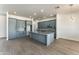 Modern kitchen with gray cabinets and granite island at 3368 W Judd Rd, San Tan Valley, AZ 85144