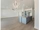 Modern kitchen island with granite countertop and pendant lighting at 3368 W Judd Rd, San Tan Valley, AZ 85144