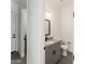 Stylish bathroom featuring granite countertop and gray cabinets at 3368 W Judd Rd, San Tan Valley, AZ 85144