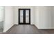 Elegant entryway with double doors and wood-look floors at 3368 W Judd Rd, San Tan Valley, AZ 85144