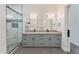Spa-like bathroom with a double vanity and a walk-in shower at 3368 W Judd Rd, San Tan Valley, AZ 85144