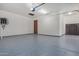 Finished garage with epoxy flooring and extra storage at 16401 W Monterey Way, Goodyear, AZ 85395