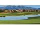 Community with lake, golf course, and mountain views at 16401 W Monterey Way, Goodyear, AZ 85395