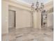 Spacious dining room featuring a chandelier and tile floors at 16401 W Monterey Way, Goodyear, AZ 85395