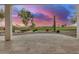 Covered patio overlooking a stunning golf course sunset at 16401 W Monterey Way, Goodyear, AZ 85395