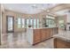 Island kitchen with granite countertops and custom cabinetry at 16401 W Monterey Way, Goodyear, AZ 85395