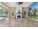 Living room featuring a fireplace and scenic mural at 16401 W Monterey Way, Goodyear, AZ 85395