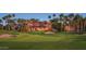 Luxury home with Spanish tile roof and palm trees at 16401 W Monterey Way, Goodyear, AZ 85395