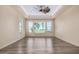 Bedroom with large windows offering a view and ceiling fan at 16401 W Monterey Way, Goodyear, AZ 85395