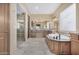 Spa-like bathroom with soaking tub and walk-in shower at 16401 W Monterey Way, Goodyear, AZ 85395