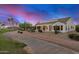 Single-story home with a golf course view and solar panels at 16401 W Monterey Way, Goodyear, AZ 85395