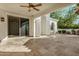 Spacious covered patio with stone tile flooring, offering an outdoor entertaining space at 16401 W Monterey Way, Goodyear, AZ 85395