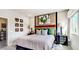 Main bedroom with a large bed and ensuite bathroom at 7577 W Darrow St, Laveen, AZ 85339