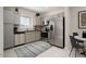 Modern kitchen with gray cabinets, stainless steel appliances, and granite countertops at 7577 W Darrow St, Laveen, AZ 85339
