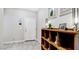 Modern entryway with tile floor and a wooden storage unit at 7577 W Darrow St, Laveen, AZ 85339