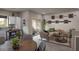 Open living room featuring a beige couch and access to a patio at 7577 W Darrow St, Laveen, AZ 85339