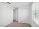 Bright bedroom with neutral carpeting and double door closet at 4183 E Brook Lynn Pl, San Tan Valley, AZ 85143