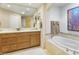 Elegant bathroom with soaking tub and double vanity at 15802 N 71St St # 307, Scottsdale, AZ 85254