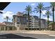 Exterior view of The Landmark building with palm trees at 15802 N 71St St # 307, Scottsdale, AZ 85254