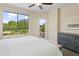 Bright bedroom with golf course views and a dresser at 15802 N 71St St # 307, Scottsdale, AZ 85254