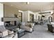 Outdoor patio area with fireplace and seating at 15802 N 71St St # 307, Scottsdale, AZ 85254