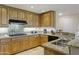 Modern kitchen with granite countertops and stainless steel appliances at 15802 N 71St St # 307, Scottsdale, AZ 85254