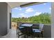 Private patio with table and chairs overlooking the golf course at 15802 N 71St St # 307, Scottsdale, AZ 85254