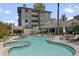 Inviting pool and spa surrounded by lush landscaping at 15802 N 71St St # 307, Scottsdale, AZ 85254