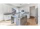 Modern kitchen with white cabinets, large island, and granite countertops at 5525 E Dusty Wren Dr, Cave Creek, AZ 85331