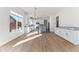 Open concept kitchen with island, granite countertops, and white cabinets at 5525 E Dusty Wren Dr, Cave Creek, AZ 85331