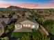 Aerial view of backyard, showcasing the spa and mountain views at 5525 E Dusty Wren Dr, Cave Creek, AZ 85331
