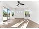 Bright bedroom with hardwood floors and sliding glass door to backyard at 5525 E Dusty Wren Dr, Cave Creek, AZ 85331