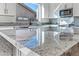Kitchen island with expansive granite countertop at 5525 E Dusty Wren Dr, Cave Creek, AZ 85331