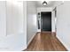 Bright entry with tile flooring and modern black door at 5525 E Dusty Wren Dr, Cave Creek, AZ 85331