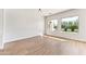 Bright living room with hardwood floors and large windows at 5525 E Dusty Wren Dr, Cave Creek, AZ 85331