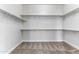 Spacious walk-in closet with ample shelving and hanging space at 5525 E Dusty Wren Dr, Cave Creek, AZ 85331