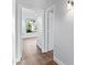 Clean hallway with light walls and wood-look tile flooring at 5525 E Dusty Wren Dr, Cave Creek, AZ 85331