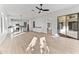 Open living space with wood-look floors and sliding glass doors to patio at 5525 E Dusty Wren Dr, Cave Creek, AZ 85331