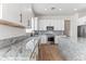 Modern kitchen with white cabinets and granite countertops at 5525 E Dusty Wren Dr, Cave Creek, AZ 85331