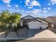 Single-story home with two-car garage and desert landscaping at 5525 E Dusty Wren Dr, Cave Creek, AZ 85331