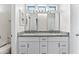 Bathroom with granite countertops, double sinks, and large mirrors at 5525 E Dusty Wren Dr, Cave Creek, AZ 85331