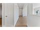 Clean hallway with light walls and wood-look tile flooring at 5525 E Dusty Wren Dr, Cave Creek, AZ 85331