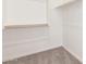 Empty closet with hanging rods and shelving at 21680 E Roundup Way, Queen Creek, AZ 85142